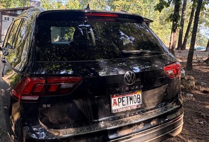 The PETMOB: a black Volkswagen Tiguan SUV with an Alabama Crimson Tide licence plate reading PETMOB.